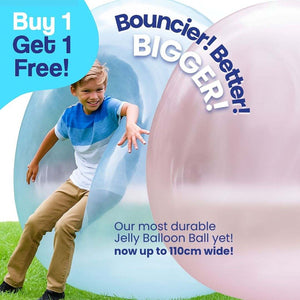 Child playing with large blue and pink Giant Jelly Balloon Ball outdoors with buy one get one free offer text