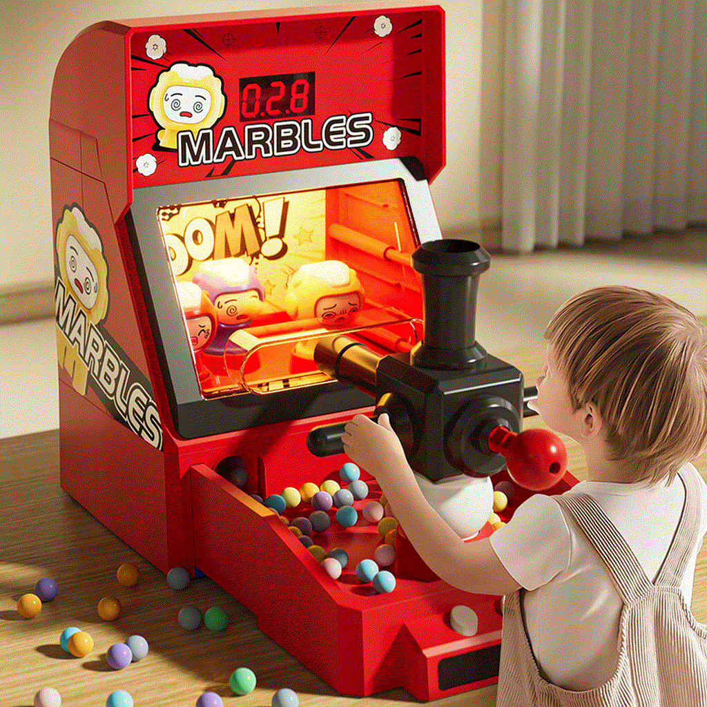 Child playing with red Children's Electric Pinball shooting game machine with colorful marbles and interactive lights