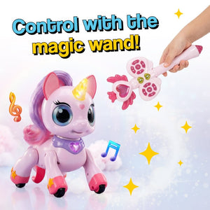 Child playing with interactive unicorn toy controlled by magic wand remote