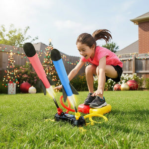 Child playing outdoors with Dual Toy Rocket Launcher launching two foam rockets in backyard